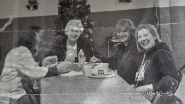 Debra Gevers, far right, celebrates with co-workers at a Thermo King Christmas party in 2011.