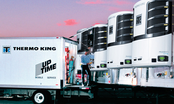 Photo of UpTime mobile service truck near a row of trailers with Precedent units