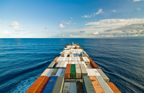 Photo of a container ship on the ocean.									